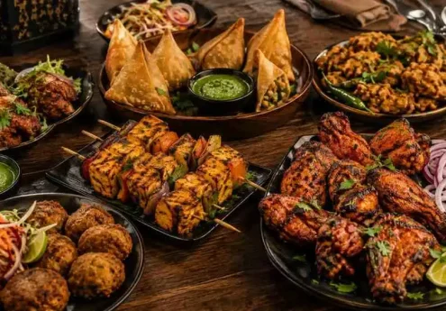 Indian street food chaat platter with pani puri, papdi chaat, and aloo tikki chaat